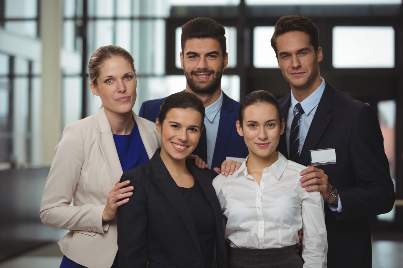 Portrait of successful businesspeople standing together in office
